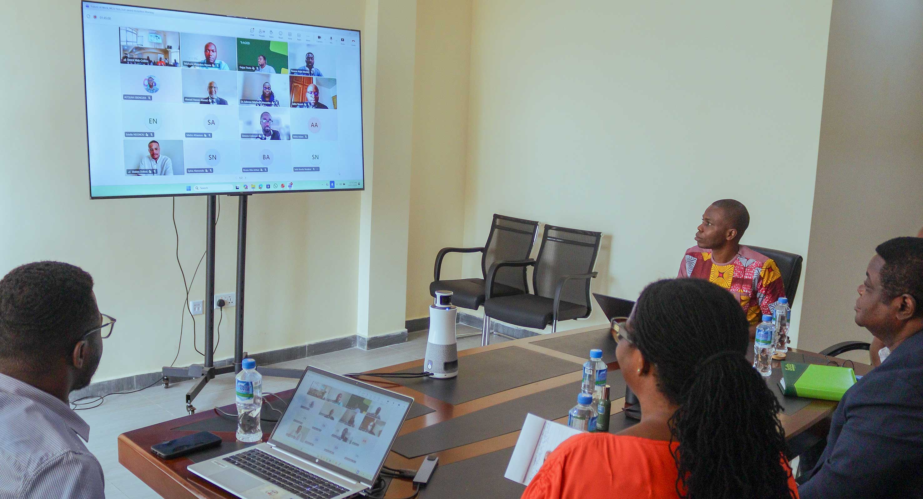 The hybrid workshop in progress, with FoW WCA team members at ISSER and online participants engaging in discussions.