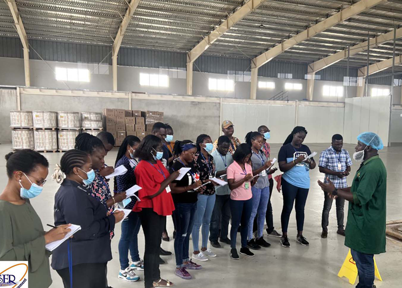 Ekumfi Juices and Fruits Factory: students interact with personnel at the production site