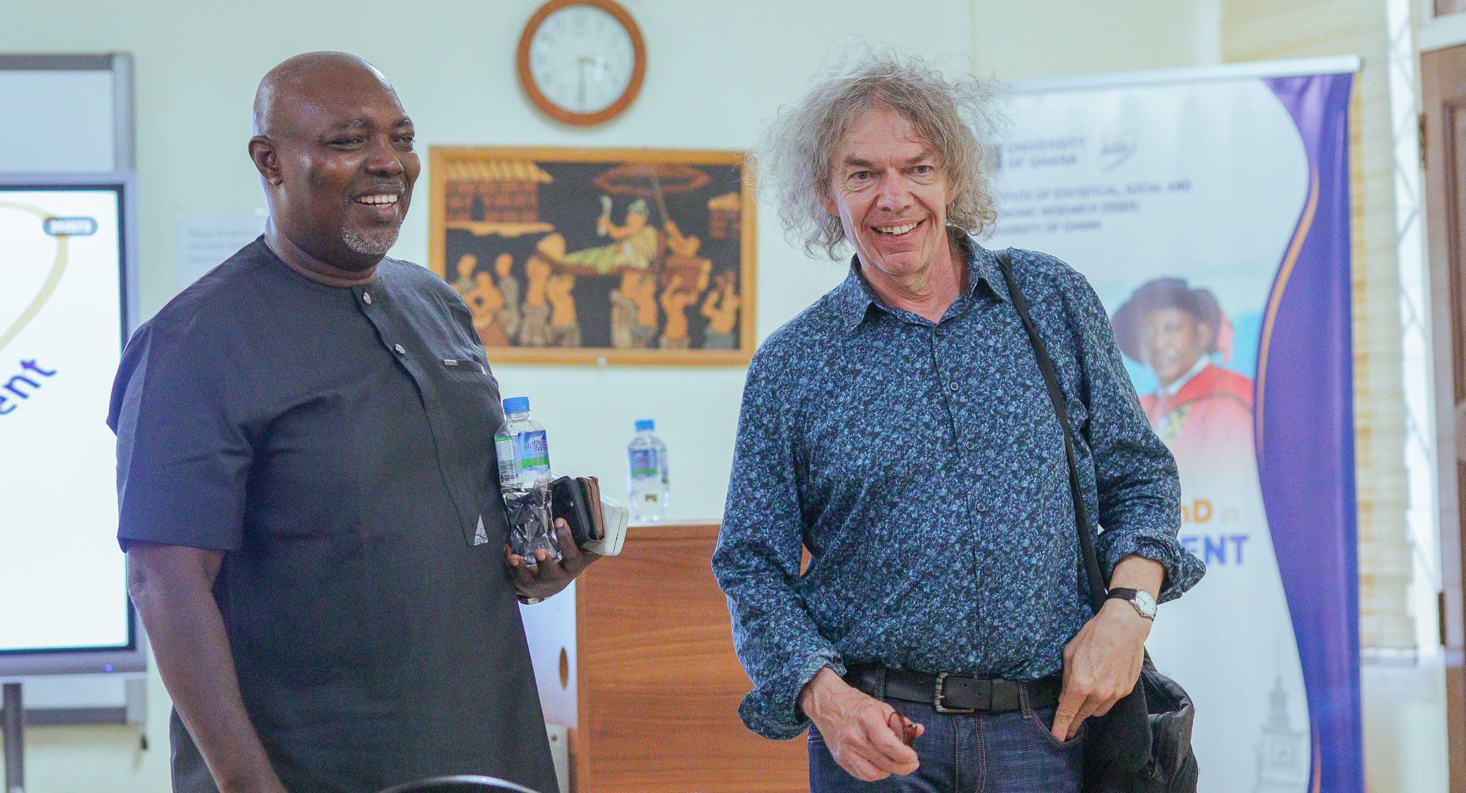 Strengthening research connections: ISSER Director Prof. Robert Darko Osei and Prof. Robert Lensink of the University of Groningen during a post-seminar networking moment.