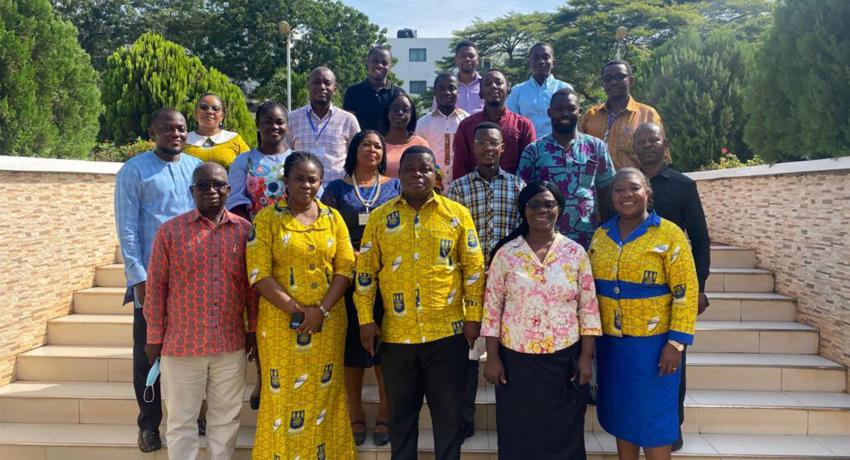 Prof Quartey and course coordinators in a group photo with participants